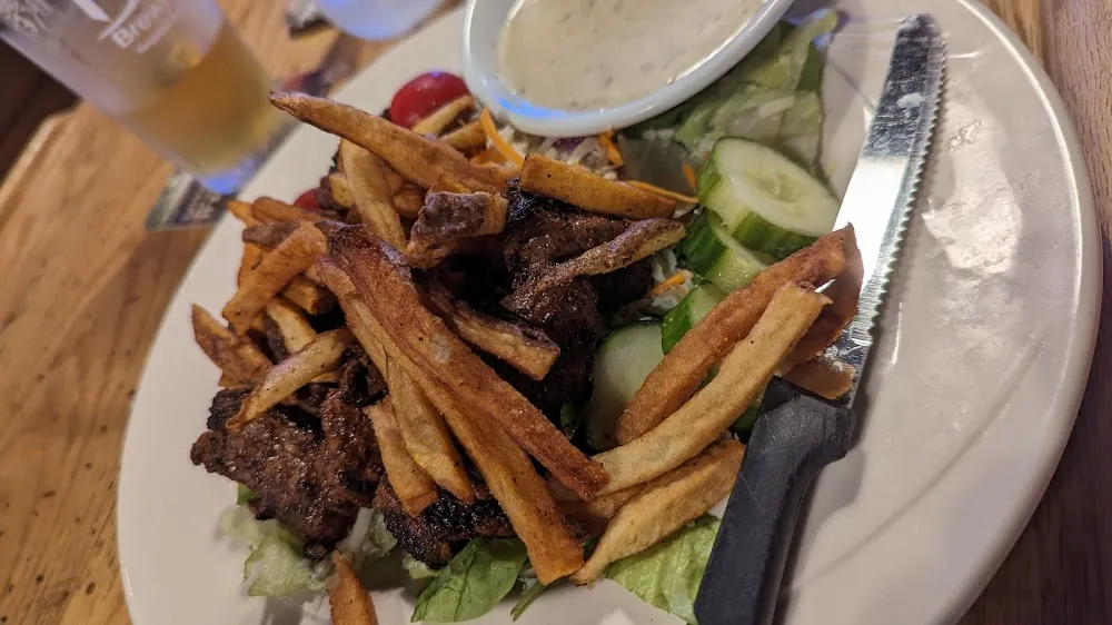 Steak Salad with Fries on Top